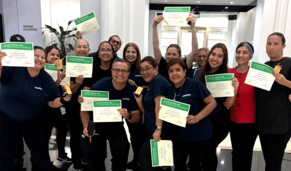 Employees from Harvard Maintenance celebrating their graduation from an English as a Second Language program with the 32BJ Training Fund